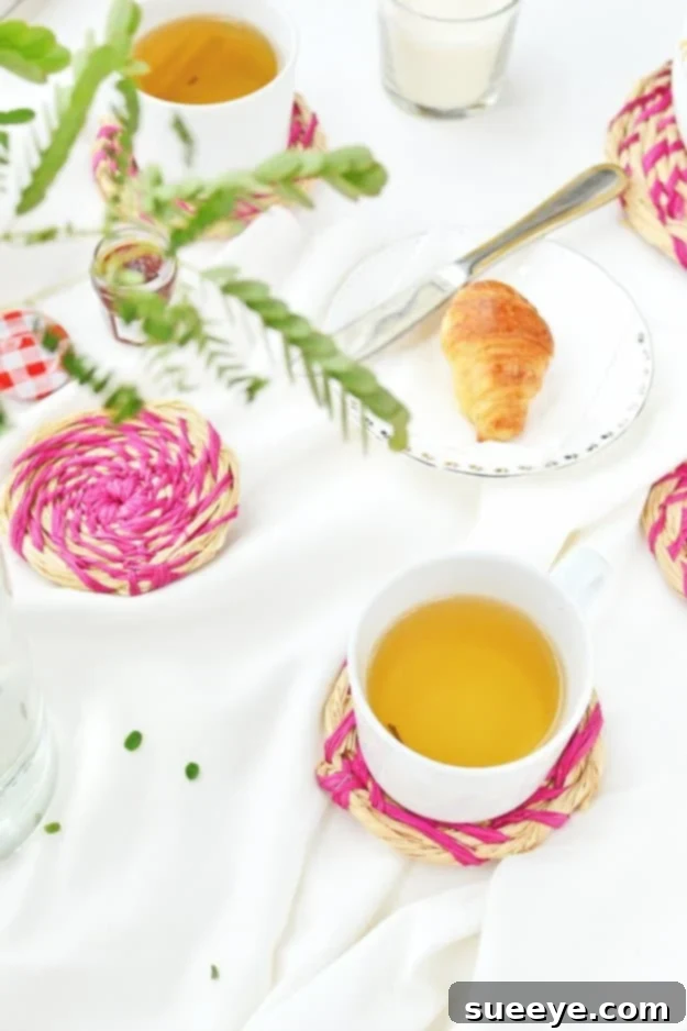 DIY Raffia Coasters for Rustic and Boho Kitchen Decor Handmade DIY raffia coasters protecting a tabletop surface