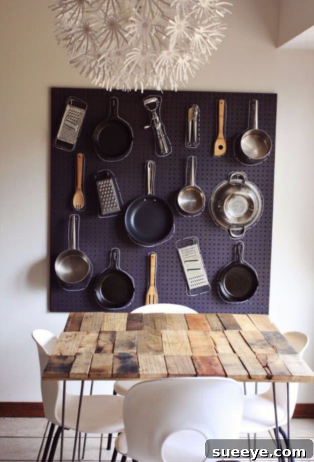 DIY Kitchen Peg Board for Smart Storage Solutions Organized DIY kitchen pegboard displaying various cooking utensils and small kitchen items