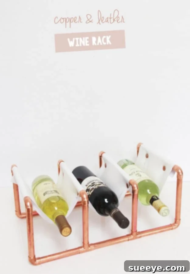 DIY Copper Pipe and Leather Wine Rack for Contemporary Kitchens Modern DIY wine rack made from copper pipes and leather straps, holding wine bottles