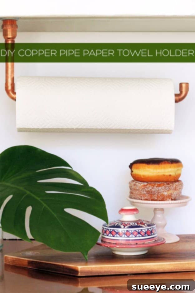 DIY Suspended Copper Pipe Paper Towel Holder for Contemporary Kitchens Sleek DIY suspended copper pipe paper towel holder mounted under a kitchen cabinet