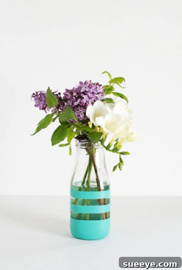 DIY Painted Bottles for Creative Kitchen Decor Assortment of DIY painted glass bottles repurposed as decorative vases or objects