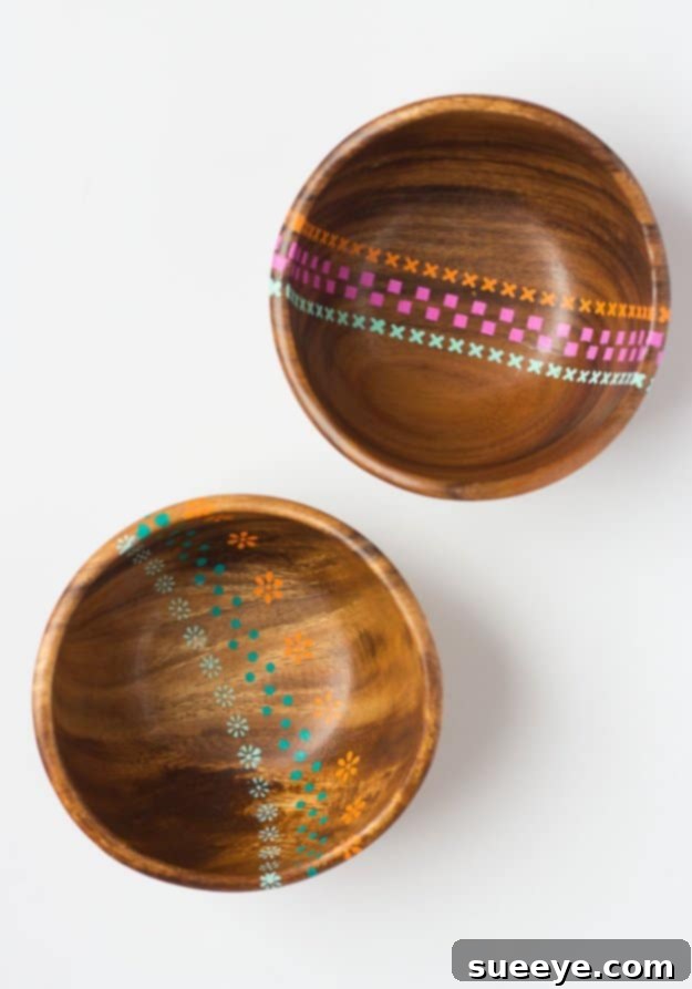 DIY Painted Wooden Bowls for Colorful Kitchen Decor Vibrantly painted wooden bowls with geometric patterns, used as decorative kitchen accents