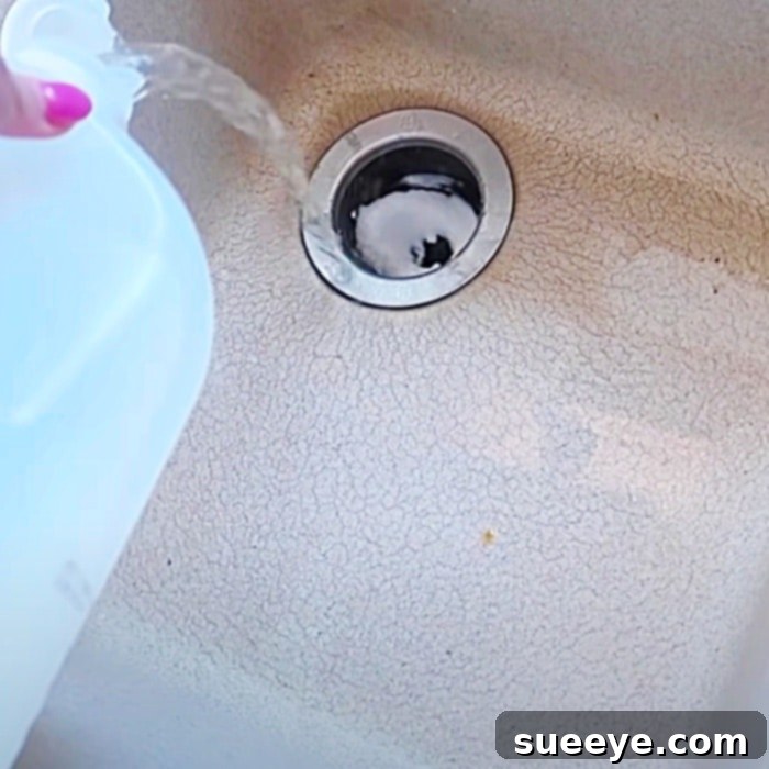 Green Solutions for Clogged Drains 3 Fizzing reaction of baking soda and vinegar in a drain