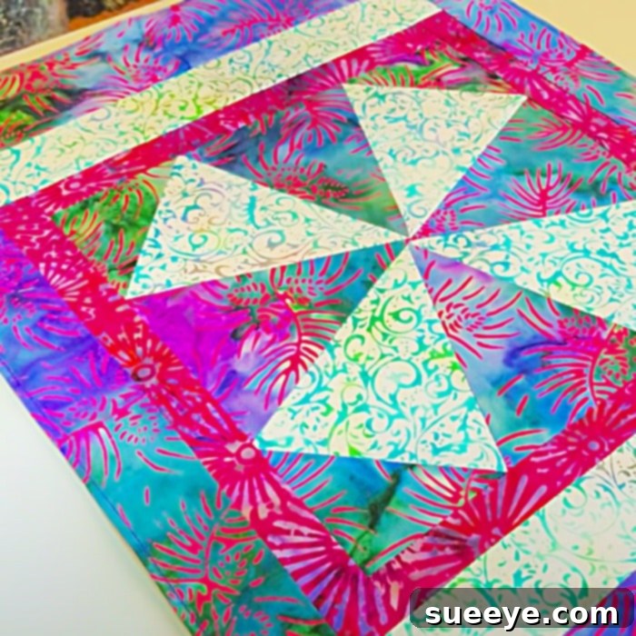 Craft Charming Windmill Placemats: Free Pattern Inside 2 Two patchwork fabric pieces sewn together, showing the initial stages of a quilt block