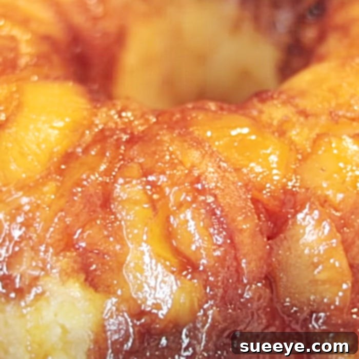 Elevated Hennessy Pineapple Upside-Down Cake 3 Baked Hennessy pineapple upside-down sheet cake cooling in the pan before inversion