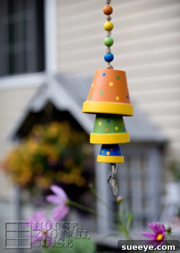 DIY Terracotta Flower Pot Wind Chime - Easy, Creative and Whimsical Garden Decor DIY Terracotta Flower Pot Wind Chime - Easy, Creative, and Whimsical Windchime Project with Wooden Beads and Twine for Garden Decor