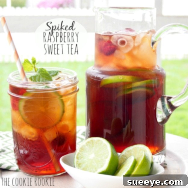 Delicious Spiked Raspberry Sweet Tea: Adult Summer Fun Spiked Raspberry Sweet Tea in a glass jar, garnished with raspberries and mint.