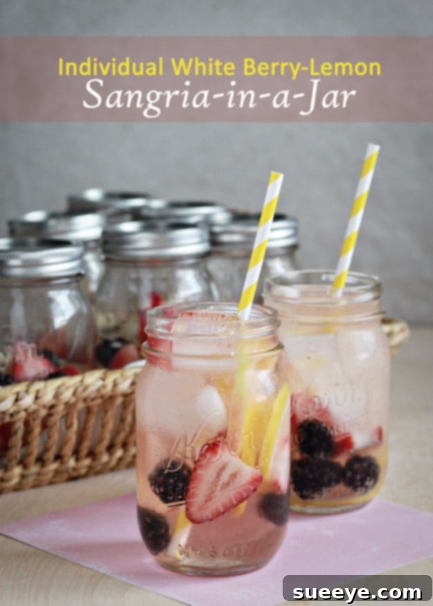Elegant Individual White Berry Lemon Sangrias Individual White Berry Lemon Sangrias served in charming mason jars with fresh fruit.