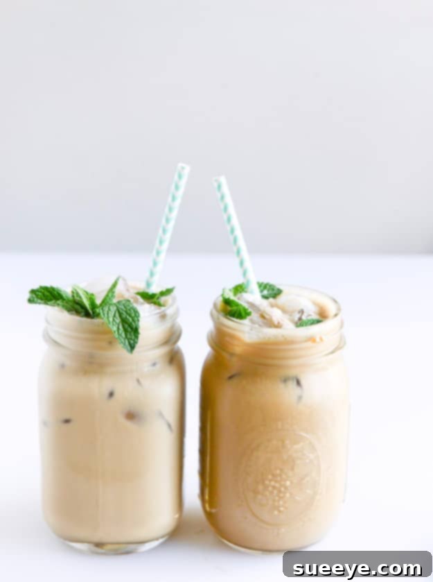 Invigorating Fresh Mint Iced Coffee: A Cool Caffeine Boost Fresh Mint Iced Coffee in a glass jar with a straw and mint sprig.