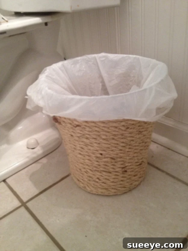 DIY stylish makeover for a dollar store trash can with paint or fabric