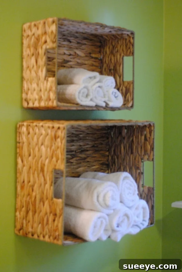 DIY bathroom towel storage solution made with dollar store items for under $5