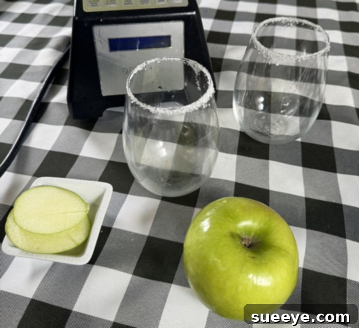 Rancher's Crown Royal Apple Slush 13 Demonstration of dipping a glass rim in sugar for garnish