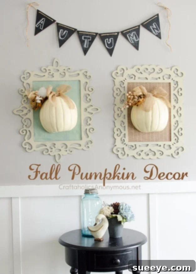 Artistic display of fall pumpkins arranged within decorative frames