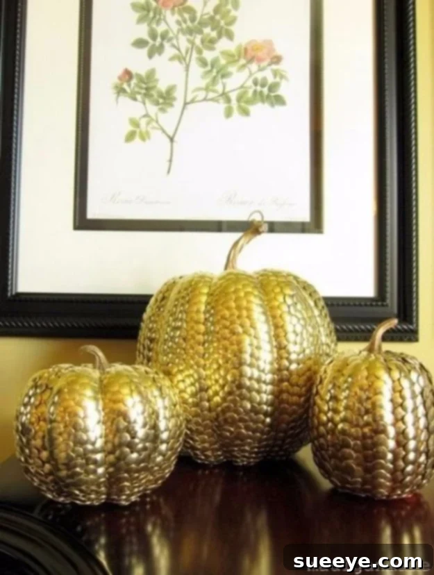 Pumpkin entirely covered with gold thumbtacks for a stylish, studded effect