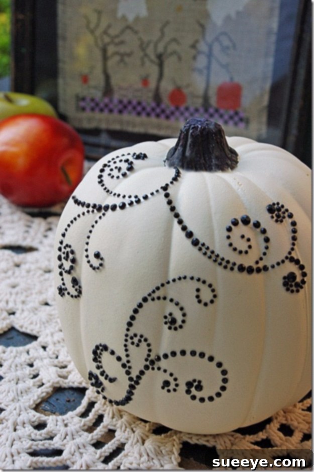 Pumpkin covered in dazzling rhinestones and embellishments for a blinged-out look