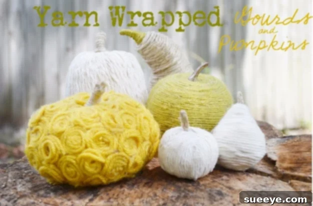 Pumpkins creatively wrapped in colorful yarn for a cozy, textured fall decoration