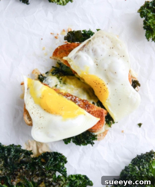Crispy Kale Grilled Cheese with Fried Eggs - Ultimate Comfort Food Indulgent Crispy Kale Grilled Cheese topped with a fried egg, a comforting and flavorful brunch or lunch.