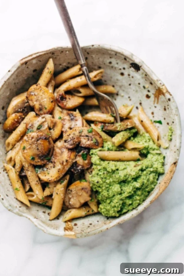 Simple Mushroom Penne with Walnut Pesto - Vegetarian Delight Rustic Simple Mushroom Penne with Walnut Pesto, a flavorful and easy vegetarian pasta dish.