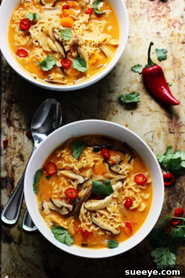 Spicy Thai Style Pumpkin Butternut Ramen - Warming Fall Dish Spicy Thai Style Pumpkin Butternut Ramen, a warming and savory soup with Asian flavors, ideal for cold weather.
