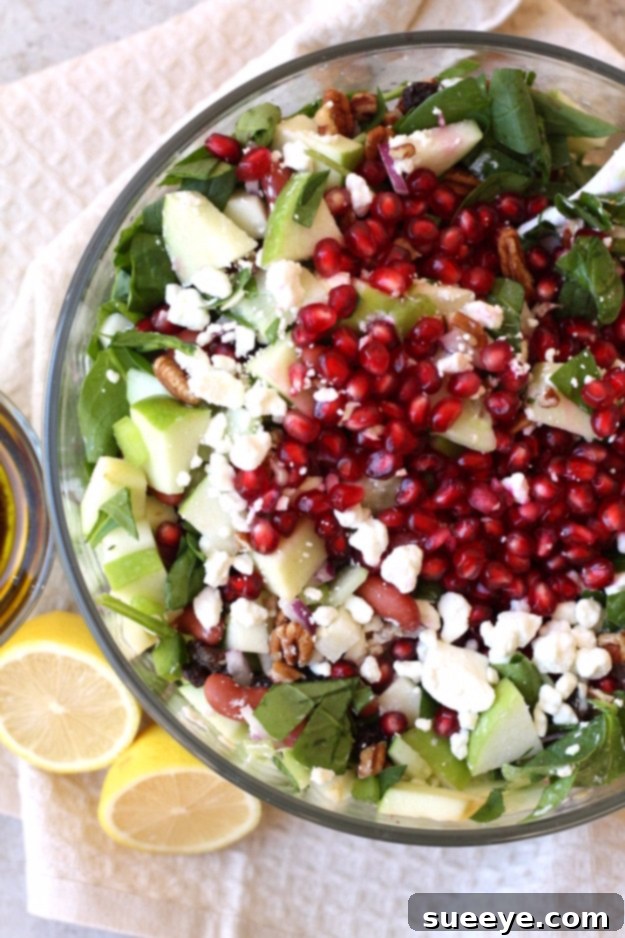 Fall Harvest Salad With Maple Vinaigrette - Healthy Autumn Dish Vibrant Fall Harvest Salad with fresh apples, pomegranates, walnuts, and a rich maple vinaigrette dressing.
