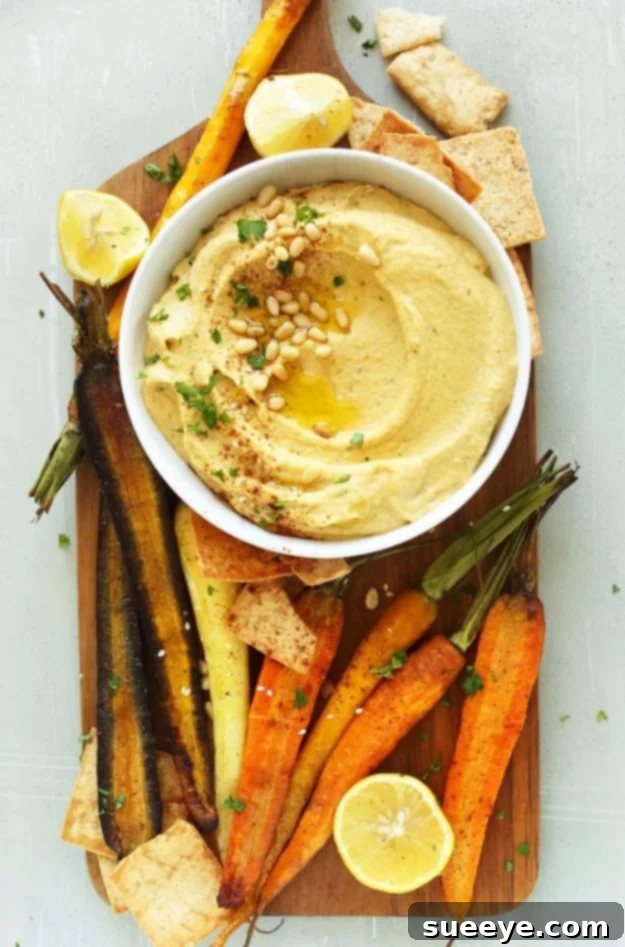 Butternut Squash Hummus - Healthy Fall Dip Recipe Creamy Butternut Squash Hummus, a flavorful autumn dip bursting with savory and sweet notes, perfect with pita chips.