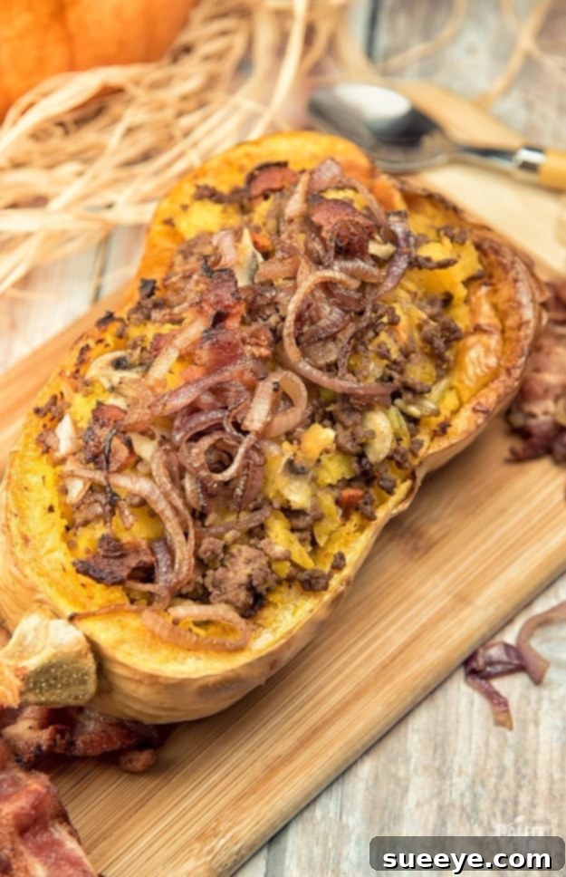 Beef Stuffed Butternut Squash - Paleo Fall Recipe Savory Beef Stuffed Butternut Squash topped with caramelized onions, a delicious and impressive Paleo-friendly fall dish.