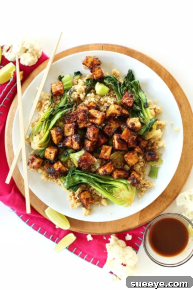 Crispy Peanut Tofu and Cauliflower Rice Stir Fry - Vegan Meal Crispy Peanut Tofu and Cauliflower Rice Stir Fry, a quick and healthy vegan fall dinner packed with Asian flavors.