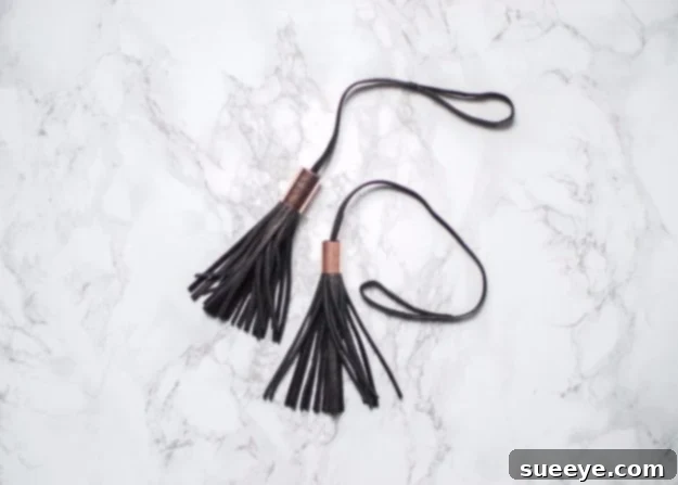 Accessorize with a handmade DIY leather copper bag tassel, a trendy gift. Chic DIY Leather Copper Bag Tassel