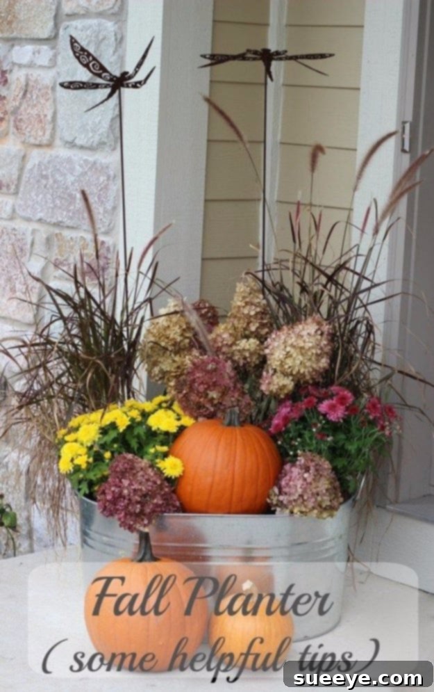 Captivating Fall Planter Design A beautifully arranged fall planter featuring a mix of colorful mums, ornamental peppers, and trailing foliage.