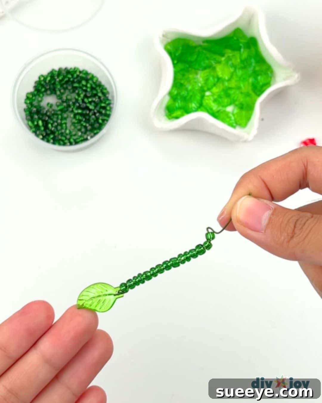 Crafting Exquisite Beaded Plants 5 Filling floral wire with glass beads for the vine of the beaded plant