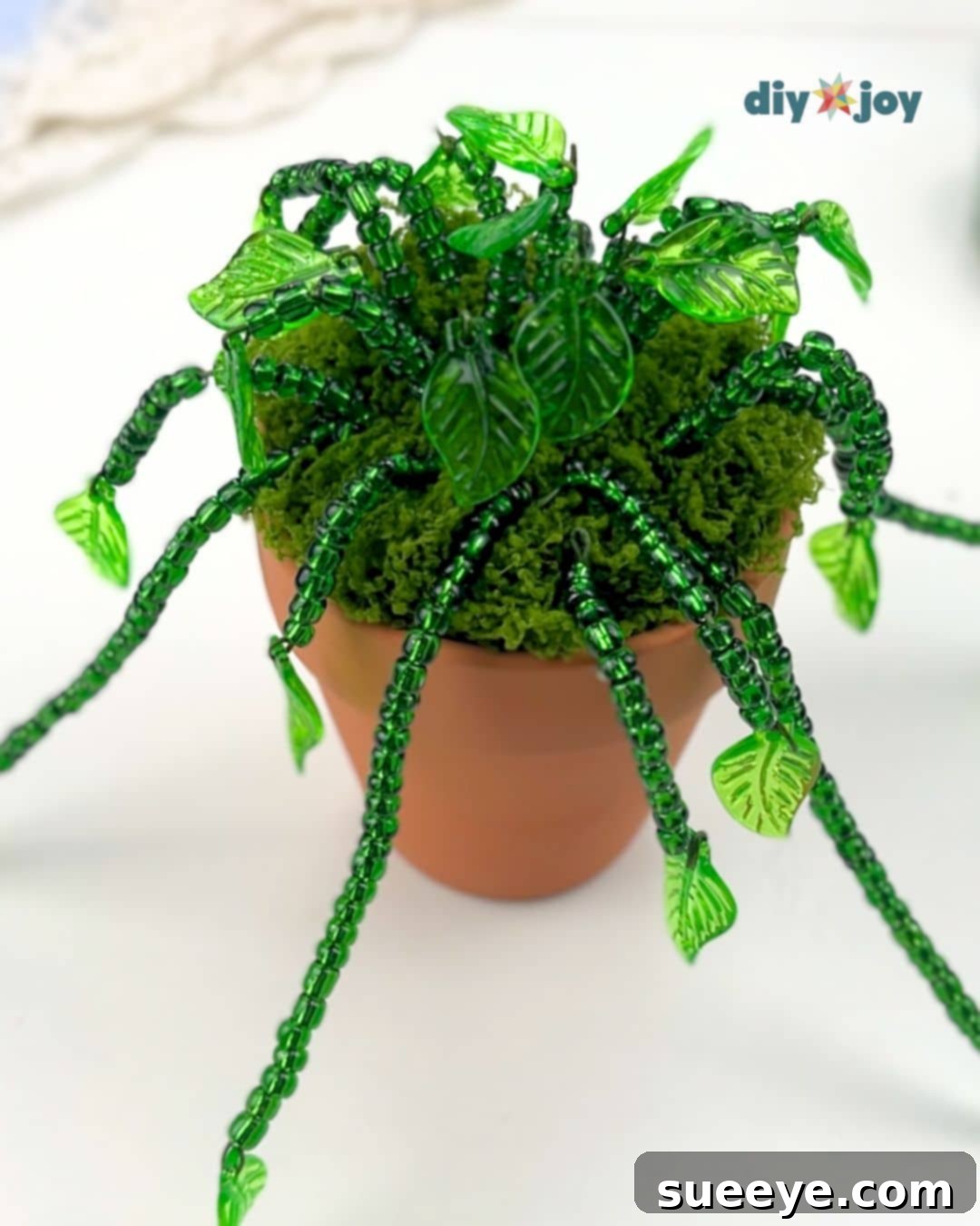 Crafting Exquisite Beaded Plants 9 Adding short beaded stems to fill the center of the tiny beaded vine plant