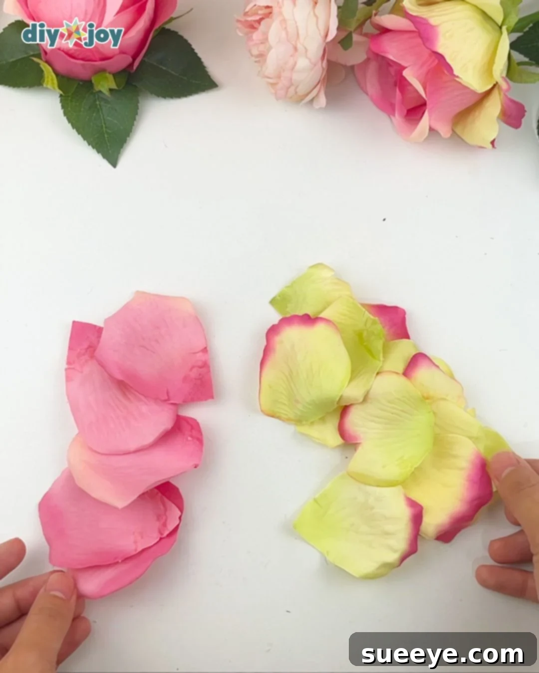 Disassembling faux flower and cutting individual petals for DIY flower light