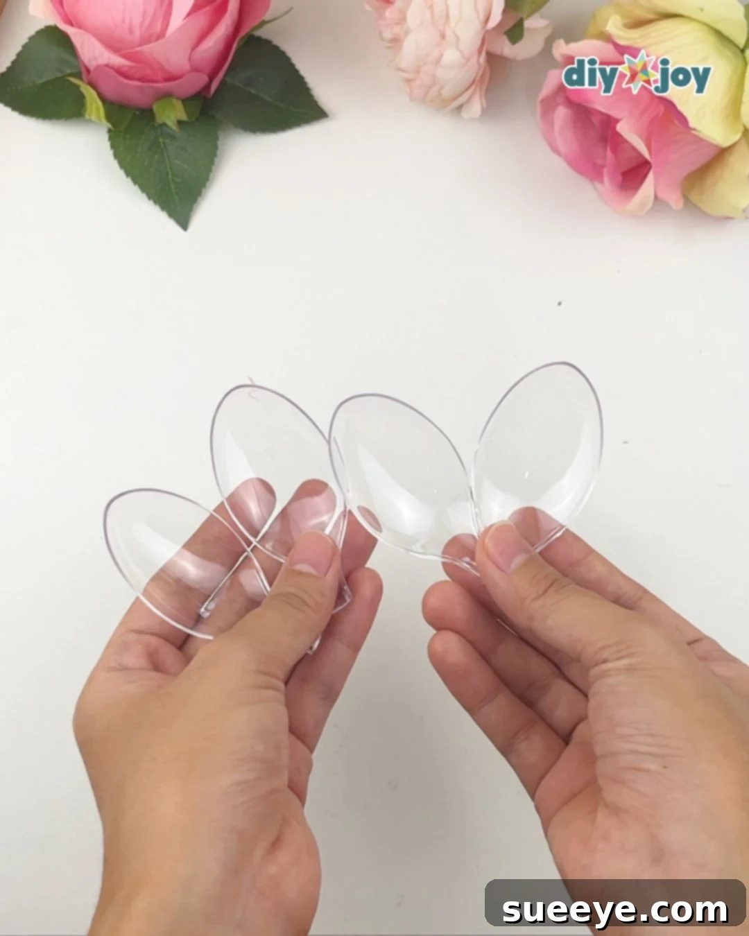 Cutting handles off plastic spoons to create a DIY flower light base