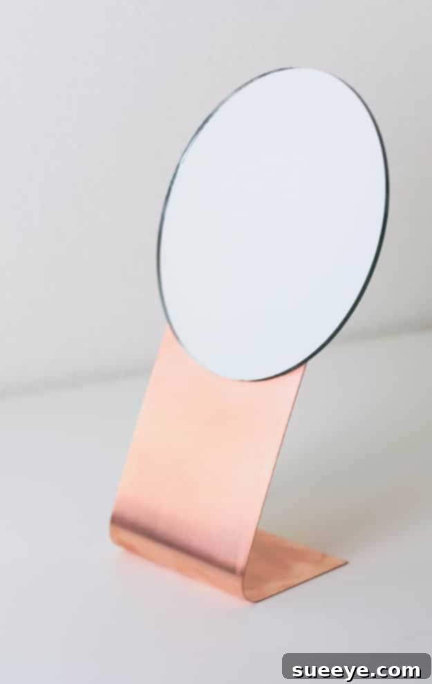 DIY Copper Mirror - Modern Industrial DIY copper mirror with a sleek, industrial-chic metallic frame