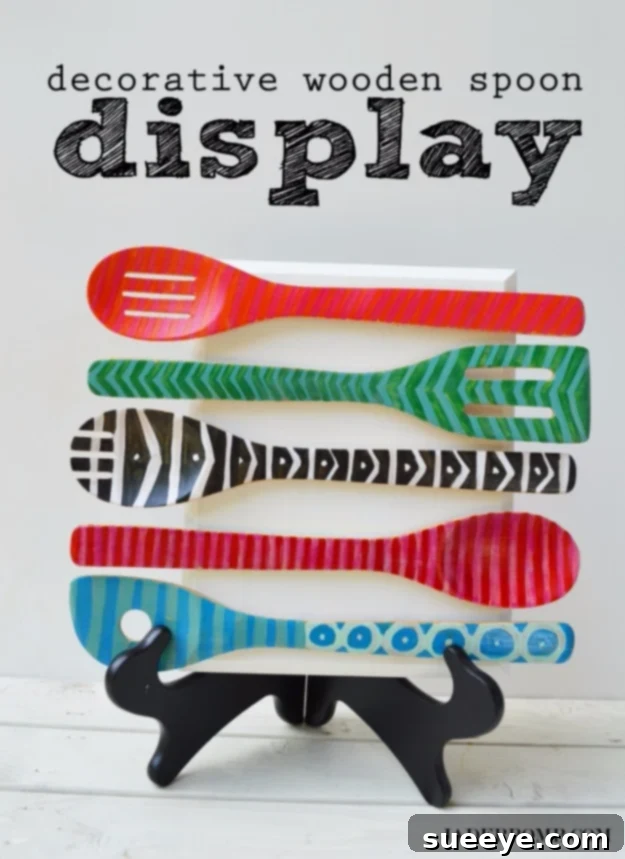 DIY Decorative Wooden Spoon Display Charming Decorative Wooden Spoon Display, a unique DIY craft gift for kitchen decor, made by painting and gluing spoons to a wooden board.