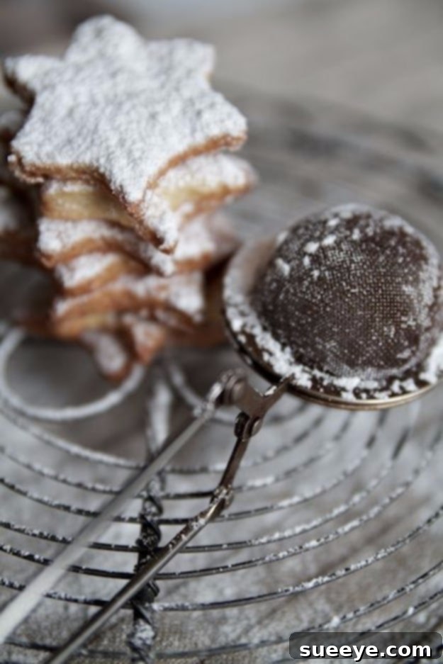 Tea strainer used for dusting powdered sugar on baked goods