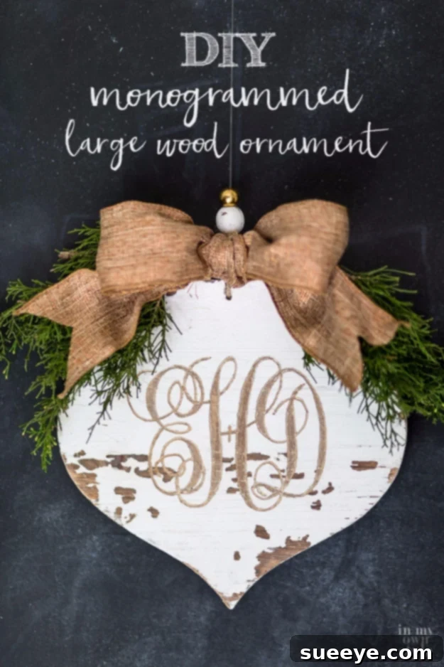 Distressed and carved large wood ornament with a personalized monogram