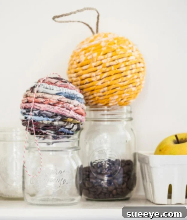 Handcrafted wrapped ball ornament made from recycled paper like catalogs or wrapping paper scraps, ideal for year-round decor.