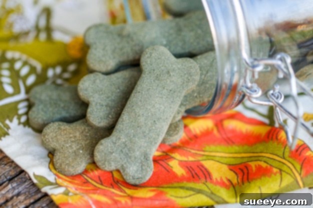 Breath Freshening Dog Treats - DIY Oral Hygiene Homemade breath freshening dog treats, resembling greenies, laid out on a baking sheet.