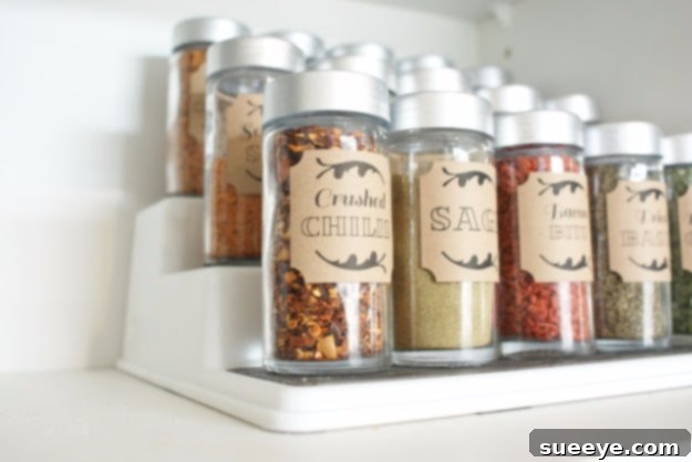 Dollar Store Spice Cupboard Organizer Spice cupboard organized using inexpensive dollar store containers and labels.