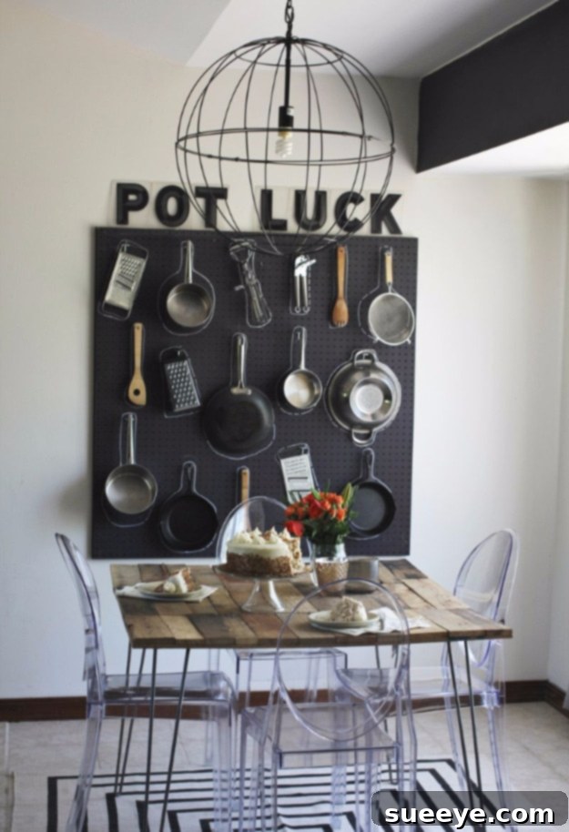 Pegboard Kitchen Organization and Decor Kitchen pegboard organizing pots, pans, and utensils as decorative wall storage.