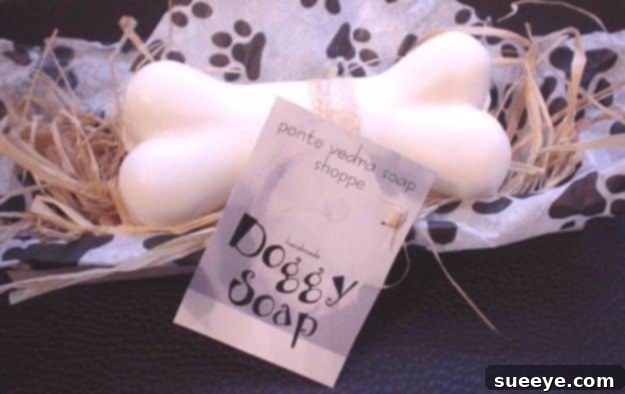 DIY Dog Grooming: Easy Homemade Dog Soap Homemade dog soap shaped like a bone, made with baking soda, vinegar, dish soap, and essential oils for a great smell.
