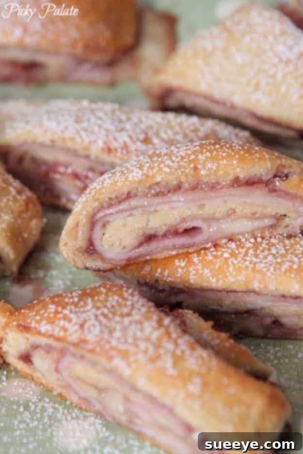 Monte Cristo Crescent Roll Ups Sweet and savory Monte Cristo Crescent Roll Ups, a delightful unique meal or snack.