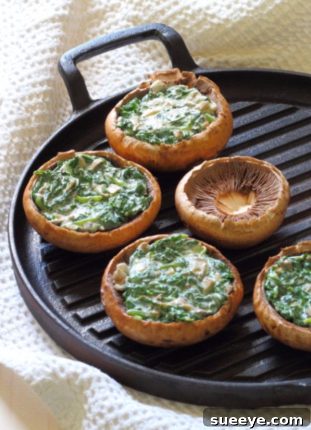 Baked Creamy Spinach Stuffed Mushrooms on a plate