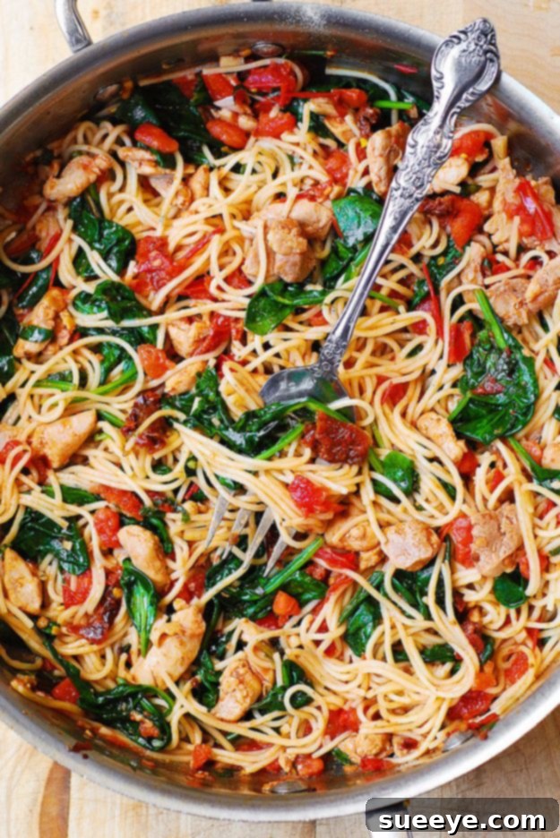 Tomato Spinach Chicken Spaghetti served in a bowl