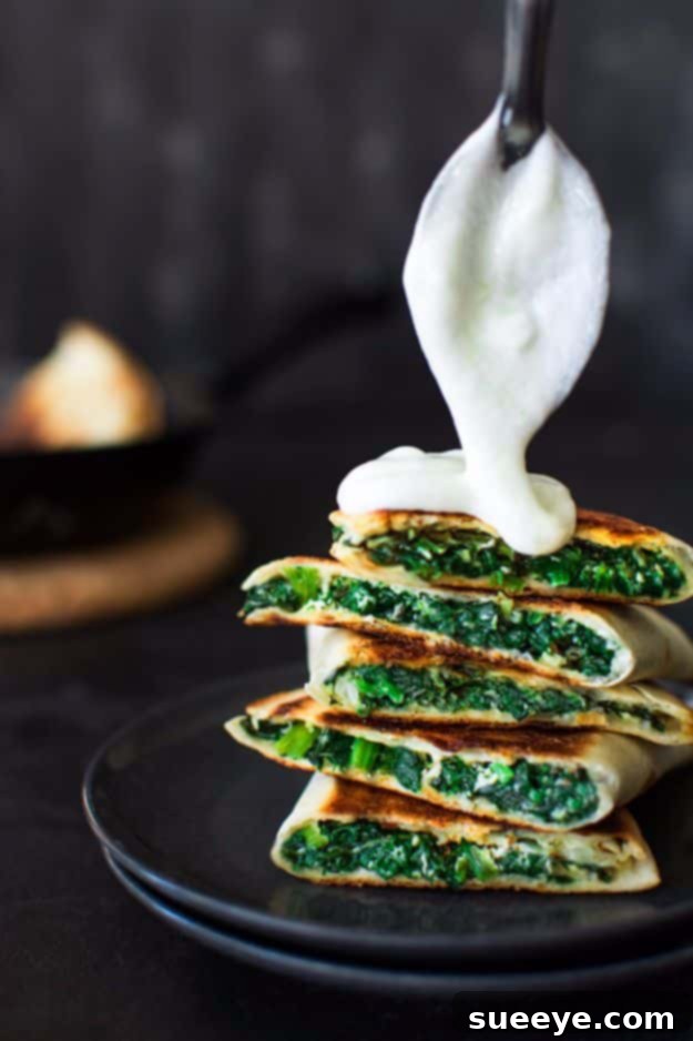 Spanakopita Quesadilla cut into triangles