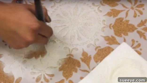 Creative Stenciled Cork Table Makeover Revamping a cork board table with a stencil design