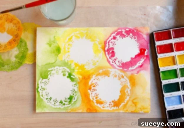 Artistic Watercolor Stencil and Doily Art Combining watercolor techniques with stencils and doilies