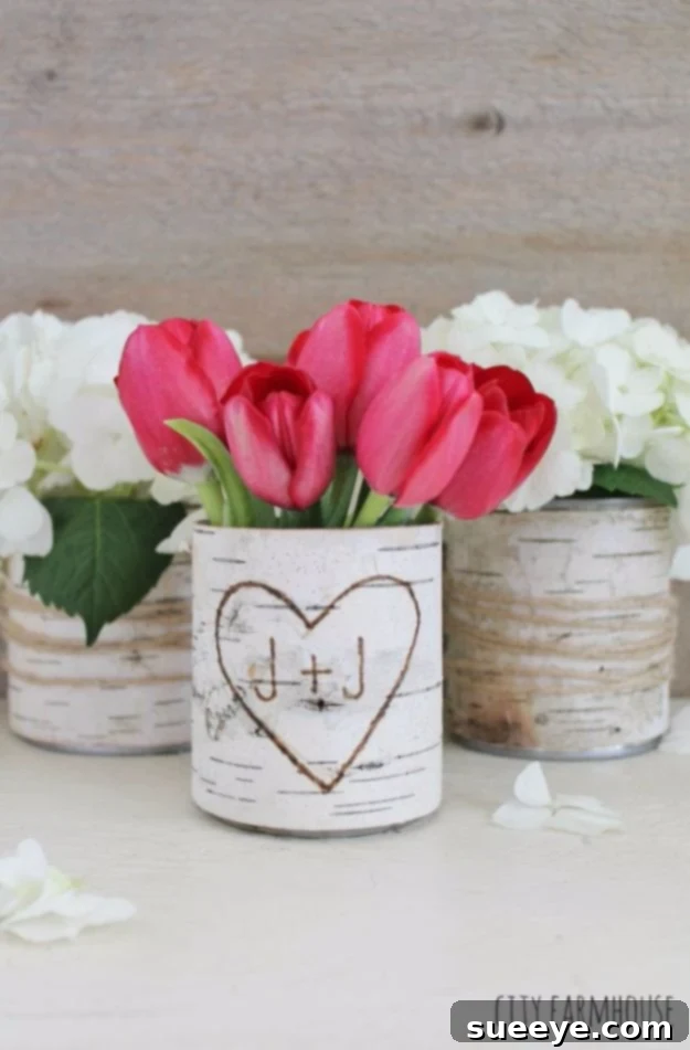 Craft rustic DIY Birch Bark Vases from tin cans, bringing natural charm to your home decor. DIY Birch Bark Vases created from recycled tin cans
