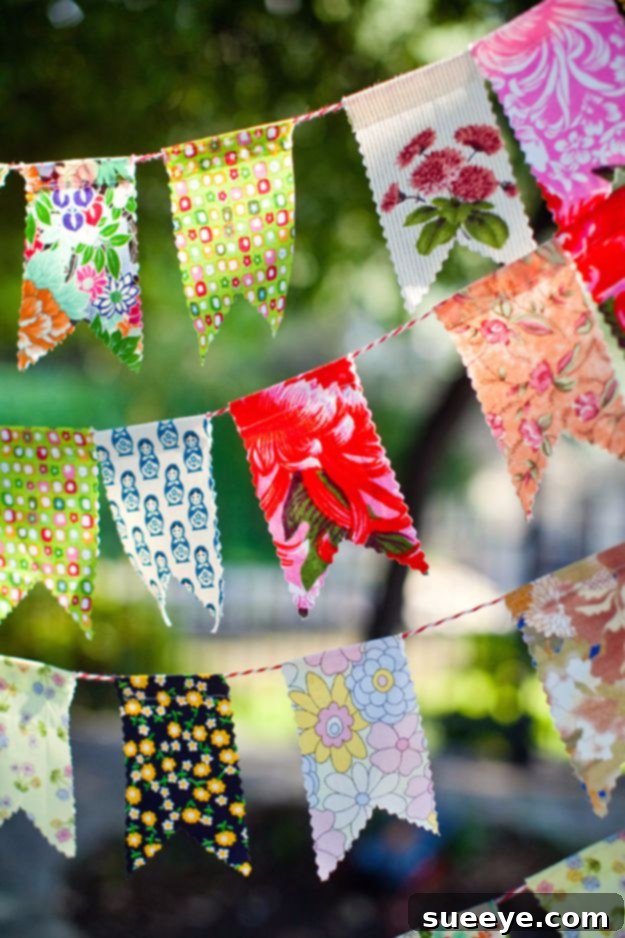 Colorful DIY party banner made from fabric scraps in various shapes, strung together.